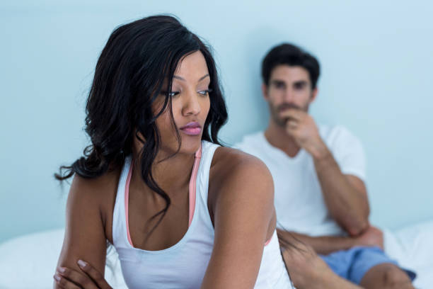 istock Upset couple ignoring each other after fight on bed 668096774