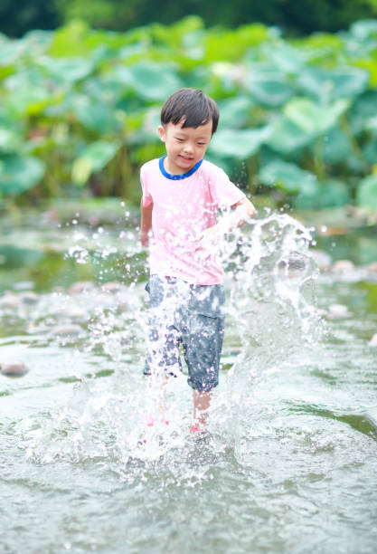 istock Cute children playing in the park 668100280