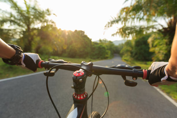 istock cyclist  riding mountain bike on tropical forest trail 668103768