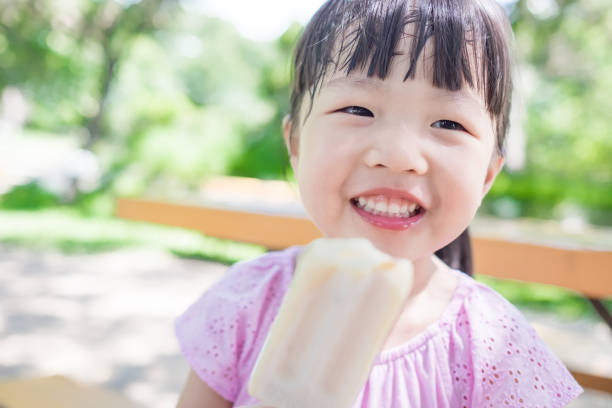 cute girl eat popsicle