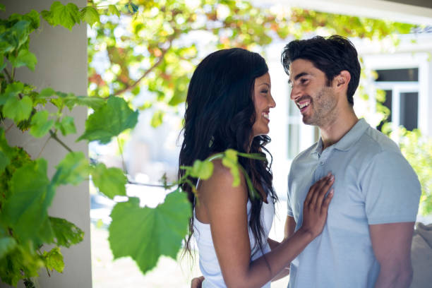 istock Young couple standing face to face 668110690