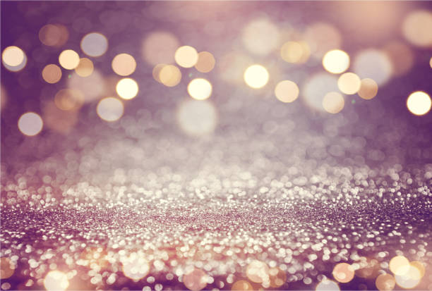 istock Pink or purple glitter and gold lights bokeh background. 668126830