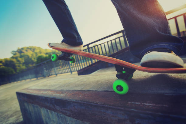 istock people legs practice skateboarding at skatepark 668129526