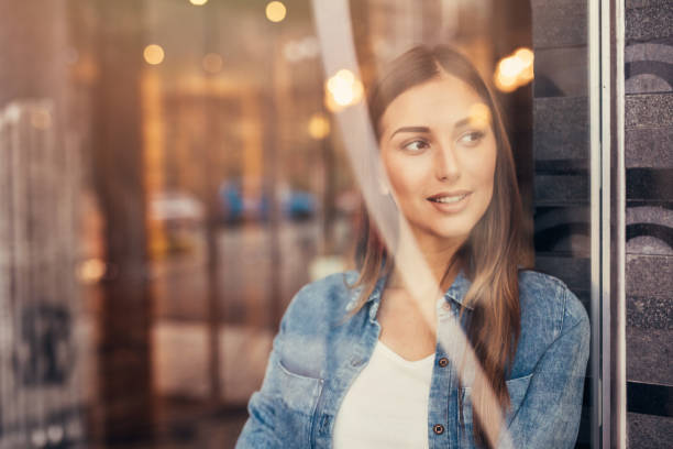 istock Beautiful woman at the window 668133226