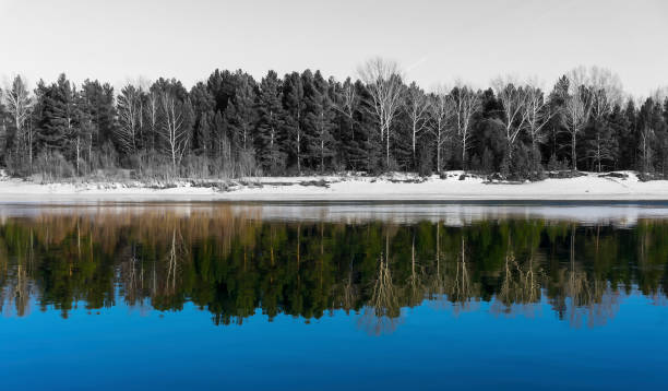 istock Monochrome landscape with a color reflection in the water. 668136848