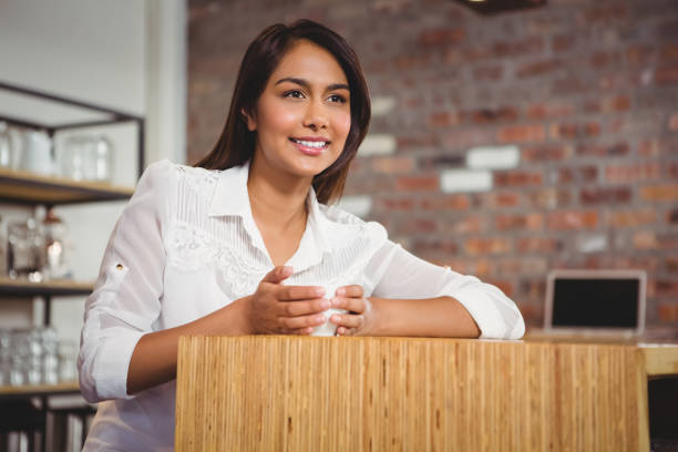 istock Pretty brunette having cup of coffee 668137380