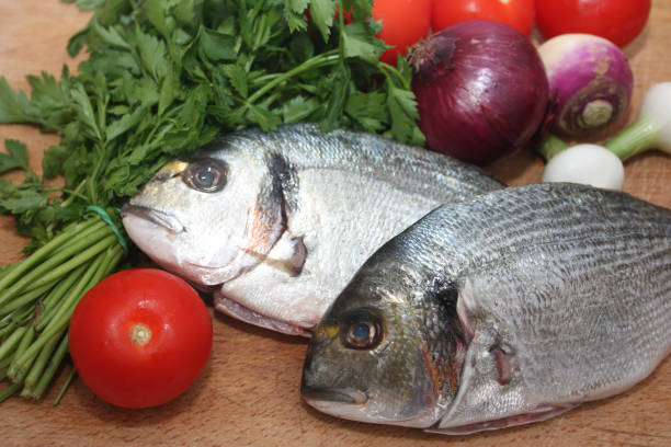 istock Gilthead Seabream and its ingredients for baking 668137384
