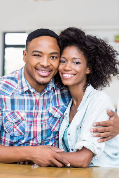 istock Young couple embracing each other in kitchen 668144224