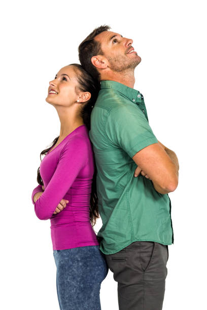 istock Couple standing back to back land looking up 668144802