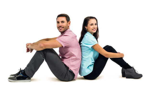 istock Portrait of couple sitting back to back 668144856