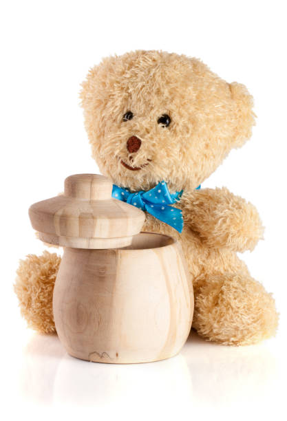 istock Toy teddy bear with wooden barrel isolated on white background 668144862