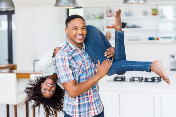 istock Man lifting his woman in kitchen 668147038