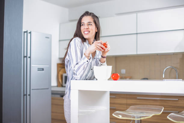 istock Happy Woman Preparing Healthy Breakfast 668147744