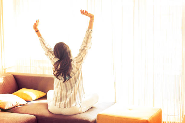 istock Young woman at home doing Yoga. 668151808