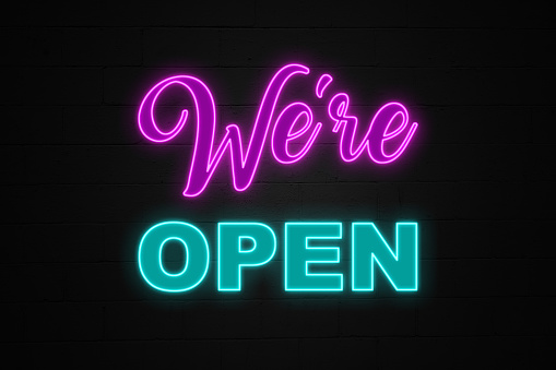 Neon light “We're open” designed in a eighties style.