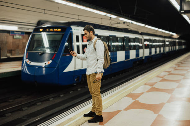 istock Tourist using smart phone in the subway station 668161308
