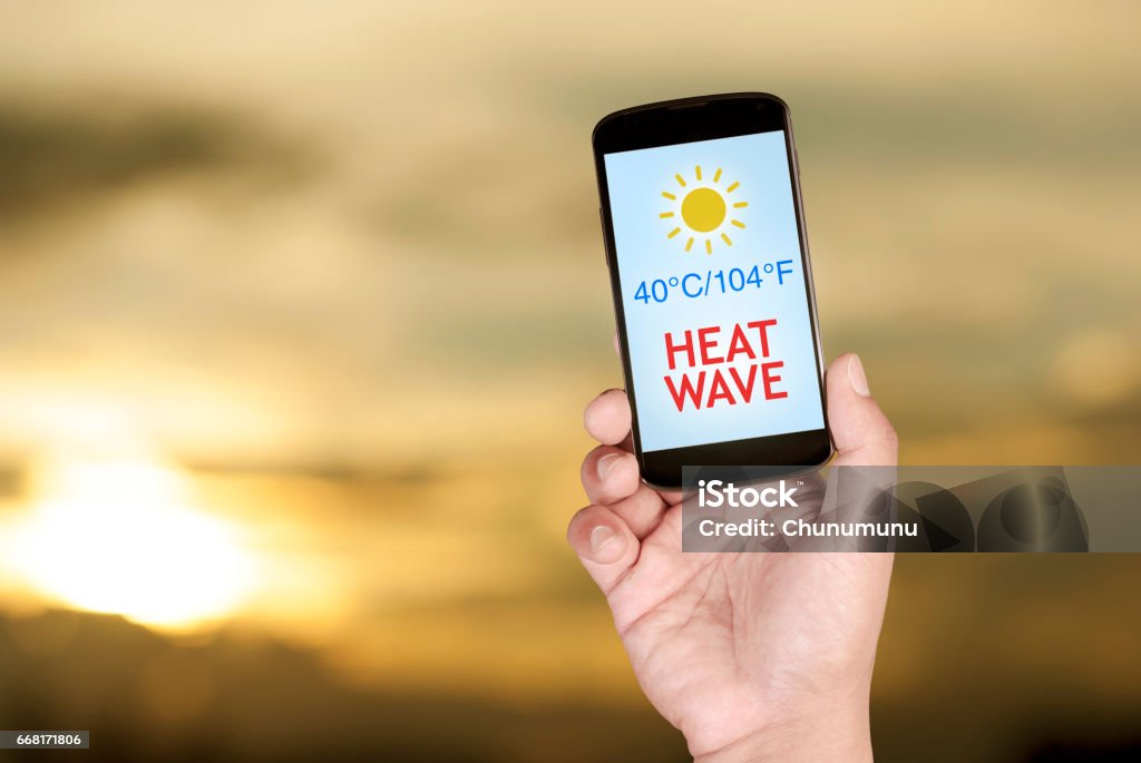 Summer heat wave in smartphone Summer heat wave alert in smartphone Heat Wave Stock Photo