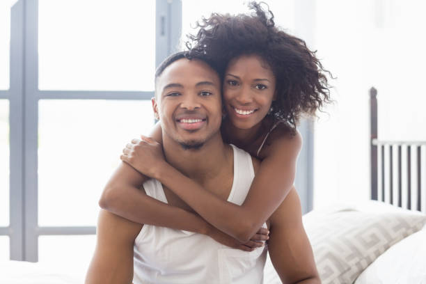 istock Young couple embracing each other in bedroom 668174820