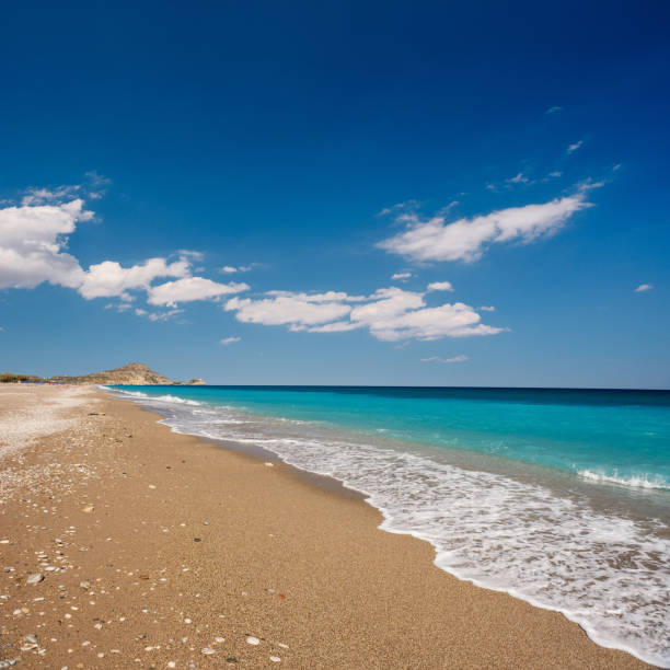 Remote Afandou beach, Rhodes Sandy Afandou beach on Rhodes, Greece afandou stock pictures, royalty-free photos & images