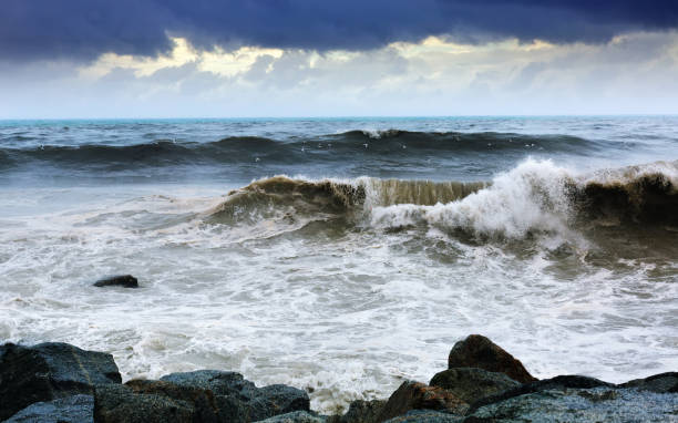 istock Sea wave near stones coast 668181148
