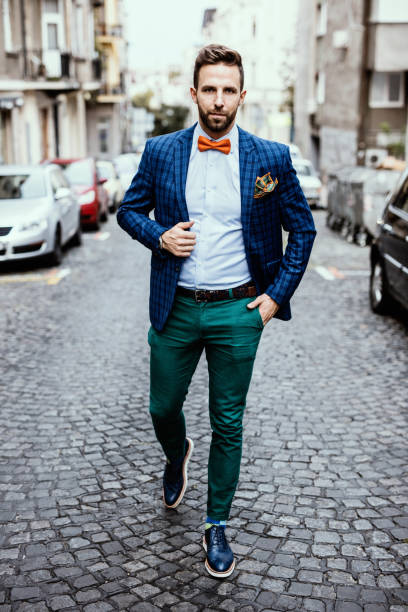 istock Tailor walking down the cobblestone street 668181378
