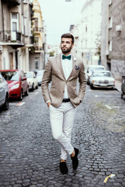 istock Hipster standing on paving stone with his legs crossed 668184948