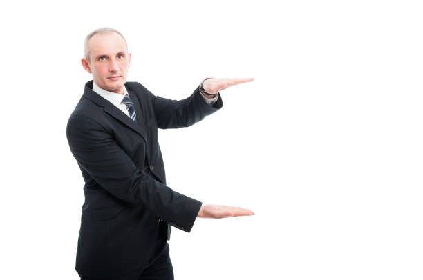 istock Portrait of aged elegant man holding copy space 668189270
