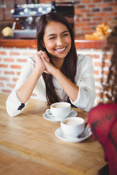 istock Female friends having coffee 668189340