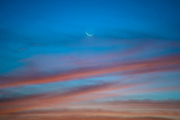 istock Sun glow with moon in Hong Kong at dawn 668193054