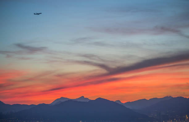 Sun glow with aeroplane over West Kowloon, Hong Kong, at dawn Sun glow with aeroplane over West Kowloon, Hong Kong, before sunrise hong kong moon night stock pictures, royalty-free photos & images