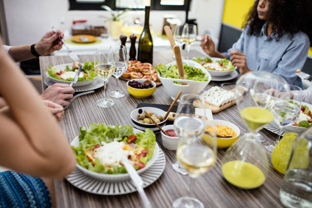 istock Group of people enjoying healthy lunch with wine. 668194464