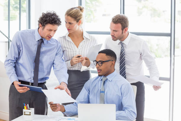 istock Business colleagues discussing a report 668197876