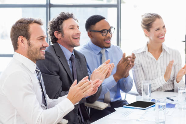 istock Businesspeople applauding while in a meeting 668200720