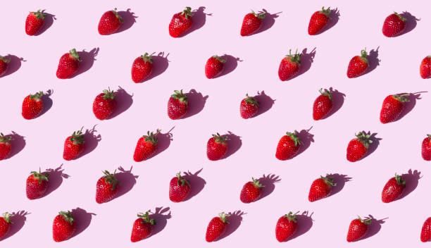 istock Strawberries on pink background seamless 668201054