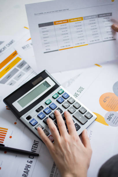 istock Closeup of Marketing Expert Hand Using Calculator 668208698