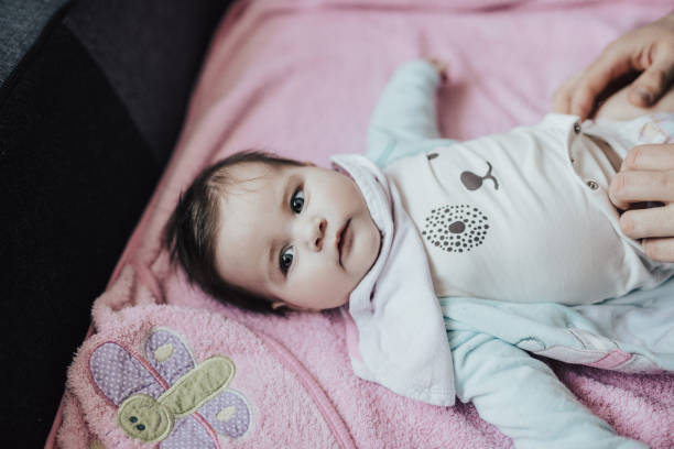 istock Cute baby lying on a pink blanket 668215792