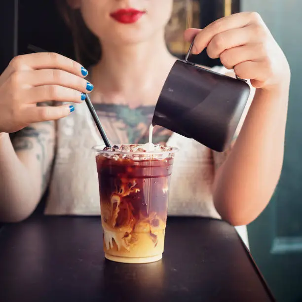 Hipster Woman Drinking Iced Coffee Concept