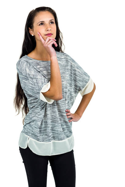 istock Young thoughtful woman with hand on cheek 668221144