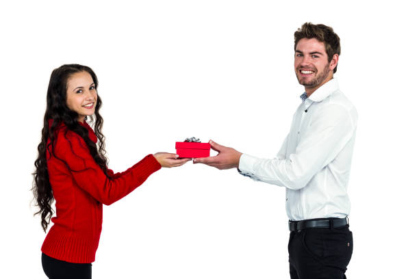 istock Young couple holding gift box 668222022