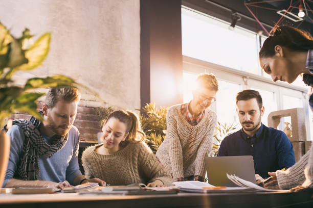istock Group of freelance workers planning new business projects in the office. 668224376
