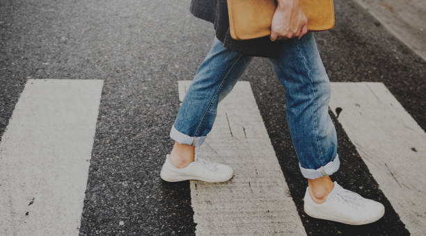 istock Young man wallking crosswalk commuter lifestyle 668225372