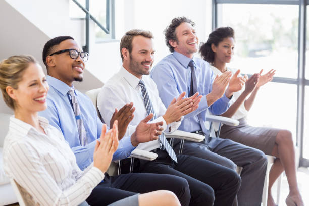 istock Businesspeople applauding while in a meeting 668226012