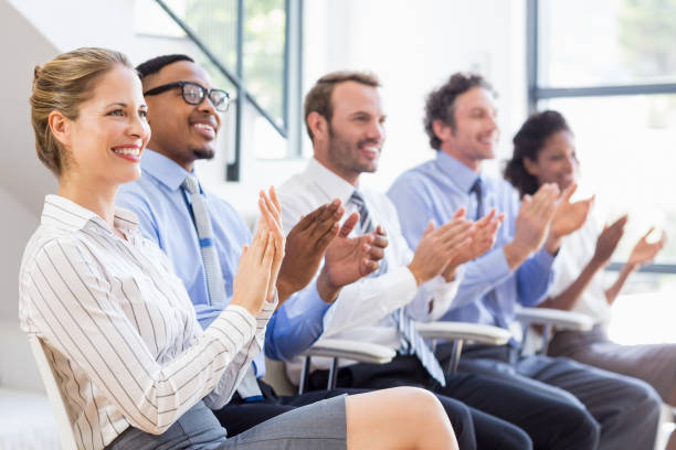 istock Businesspeople applauding while in a meeting 668226064
