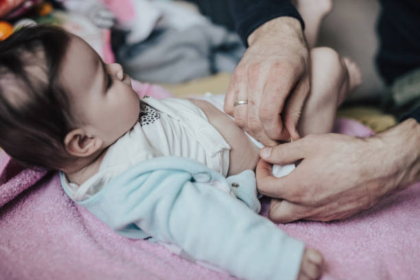 istock Baby girl changing diapers 668226396