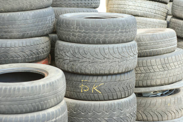 istock Pile of tires and wheels for rubber. Closeup for design work 668226412