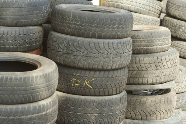 istock Pile of tires and wheels for rubber. Closeup for design work 668226418