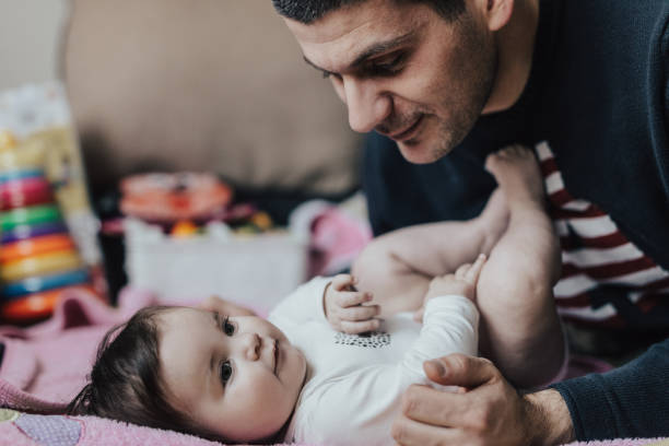 istock Beautiful baby with her father 668226648