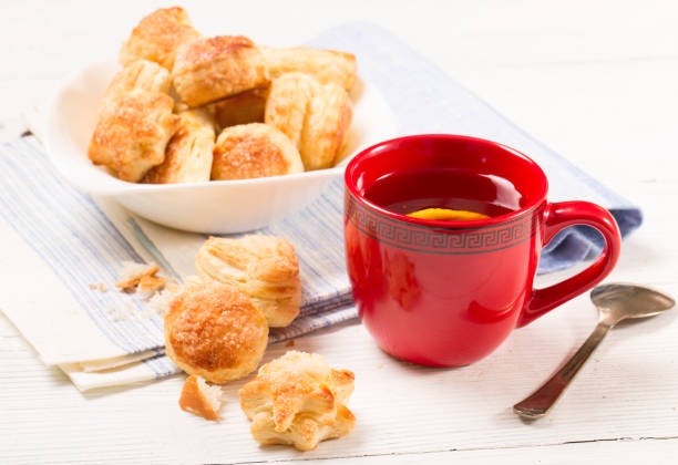 istock Tea with a lemon and cookies from puff pastry 668233222