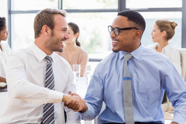istock Business colleagues shaking hands during a meeting 668233294