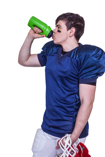 istock American football player drinking water 668239218